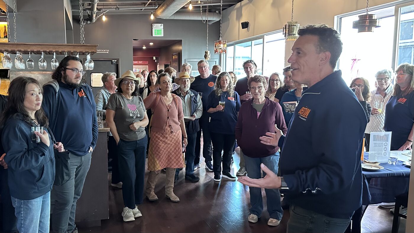 Jon speaking to a packed room at Little Star Pizza